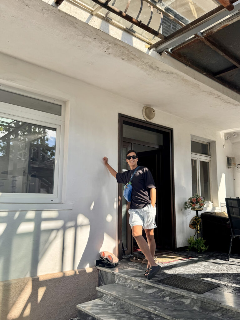 ChrisxBianca, Chris & Bianca, Albania, Shkoder, chris standing outside friendship dorms hostel.